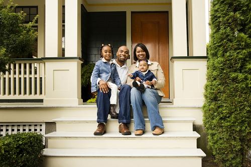 a family sitting on their front porch